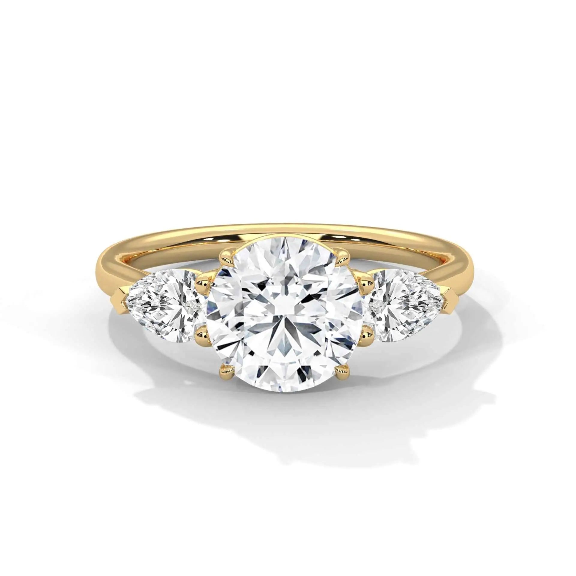 Three-stone diamond ring in yellow gold with a round center stone and two side stones