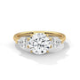 Three-stone diamond ring in yellow gold with a round center stone and two side stones