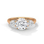 Three-stone diamond ring in rose gold with a round center stone and two side stones