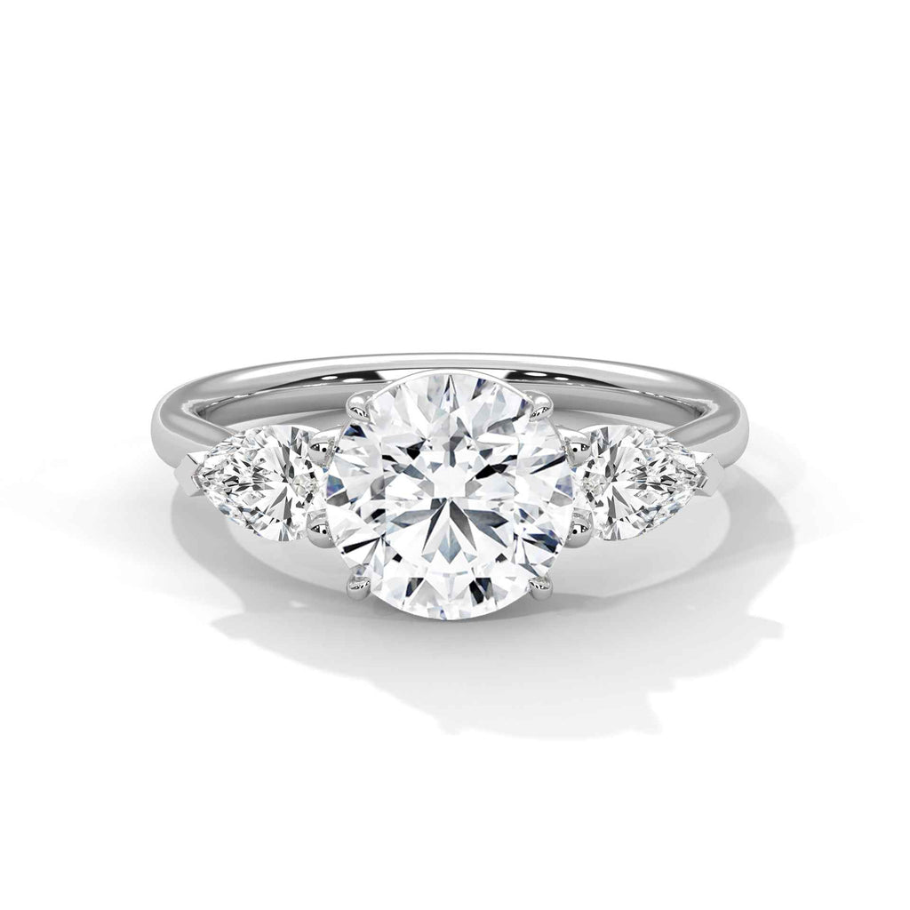 Platinum three-stone engagement ring with round center and round side stones