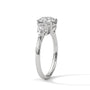 Three-stone diamond ring in platinum with a round center stone and two side stones