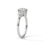 Three-stone diamond ring in platinum with a round center stone and two side stones