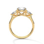 Three-stone diamond ring in yellow gold with round center stone and side stones, top view