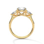 Three-stone diamond ring in yellow gold with round center stone and side stones, top view