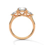 Three-stone diamond ring in rose gold with round center stone and side stones, top view