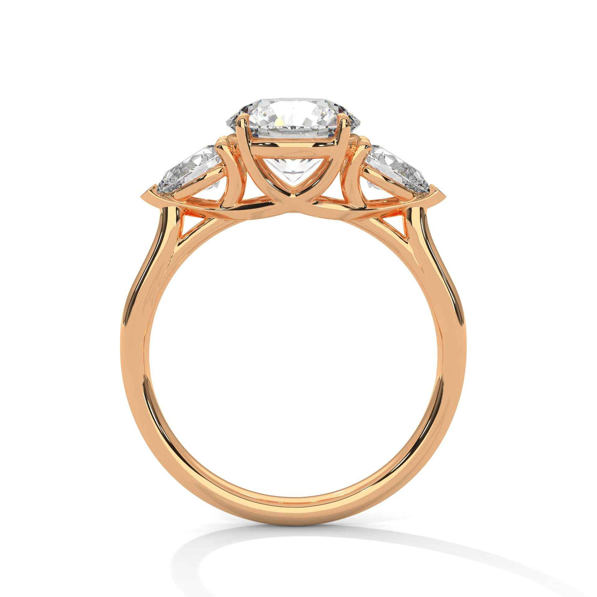 Three-stone diamond ring in rose gold with round center stone and side stones, top view