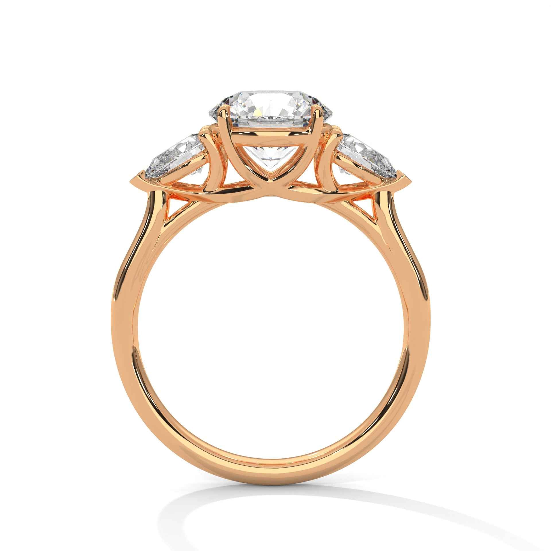 Rose gold three-stone engagement ring with oval center and pear side stones