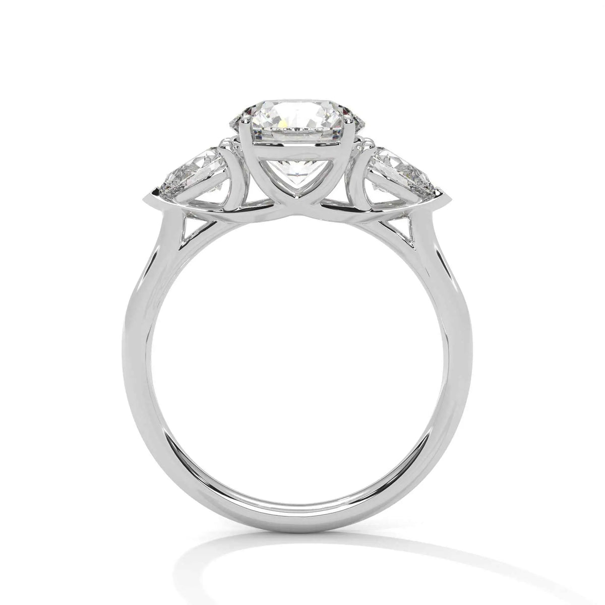 Three-stone diamond ring in platinum with round center stone and side stones, top view