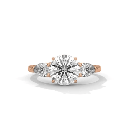 Three-stone diamond ring with round center and side diamonds, rose gold band