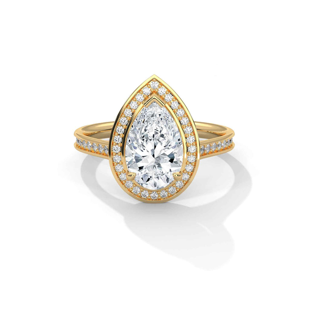 Pear halo diamond ring, yellow gold with large pear center and pavé accents.