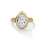 Pear halo diamond ring, yellow gold with large pear center and pavé accents.