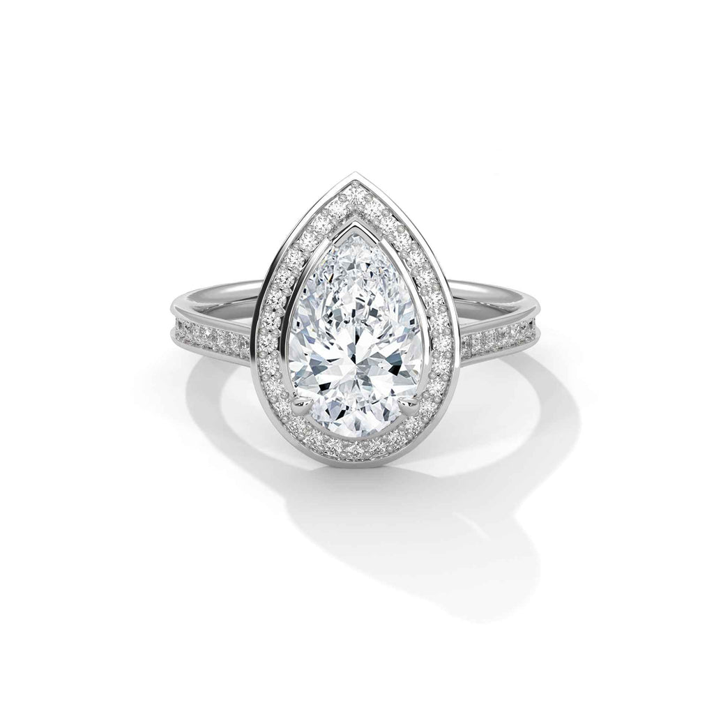 Pear halo diamond ring, platinum with pear-shaped center and pavé halo and band.