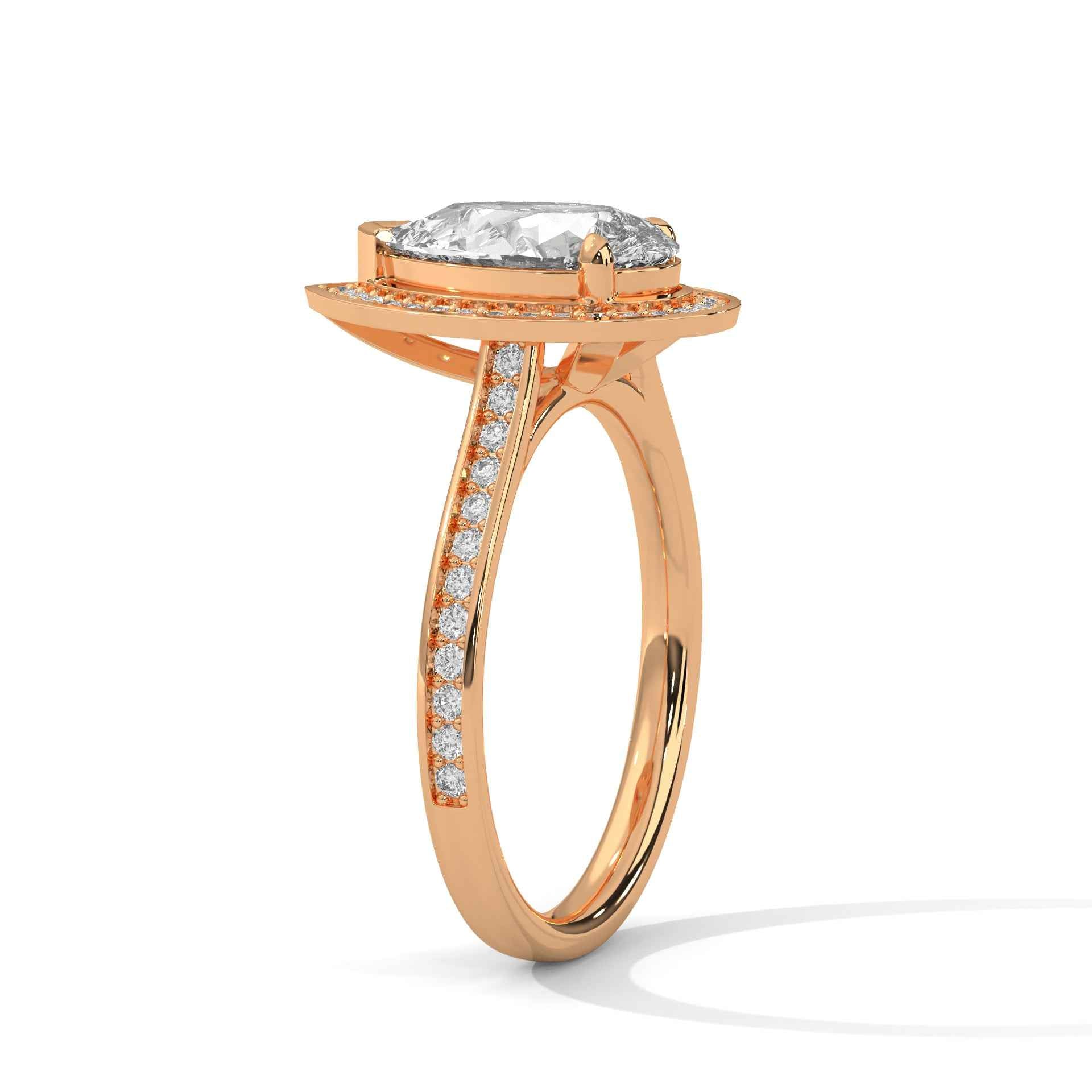 Rose gold pear-cut halo engagement ring with pavé side stones