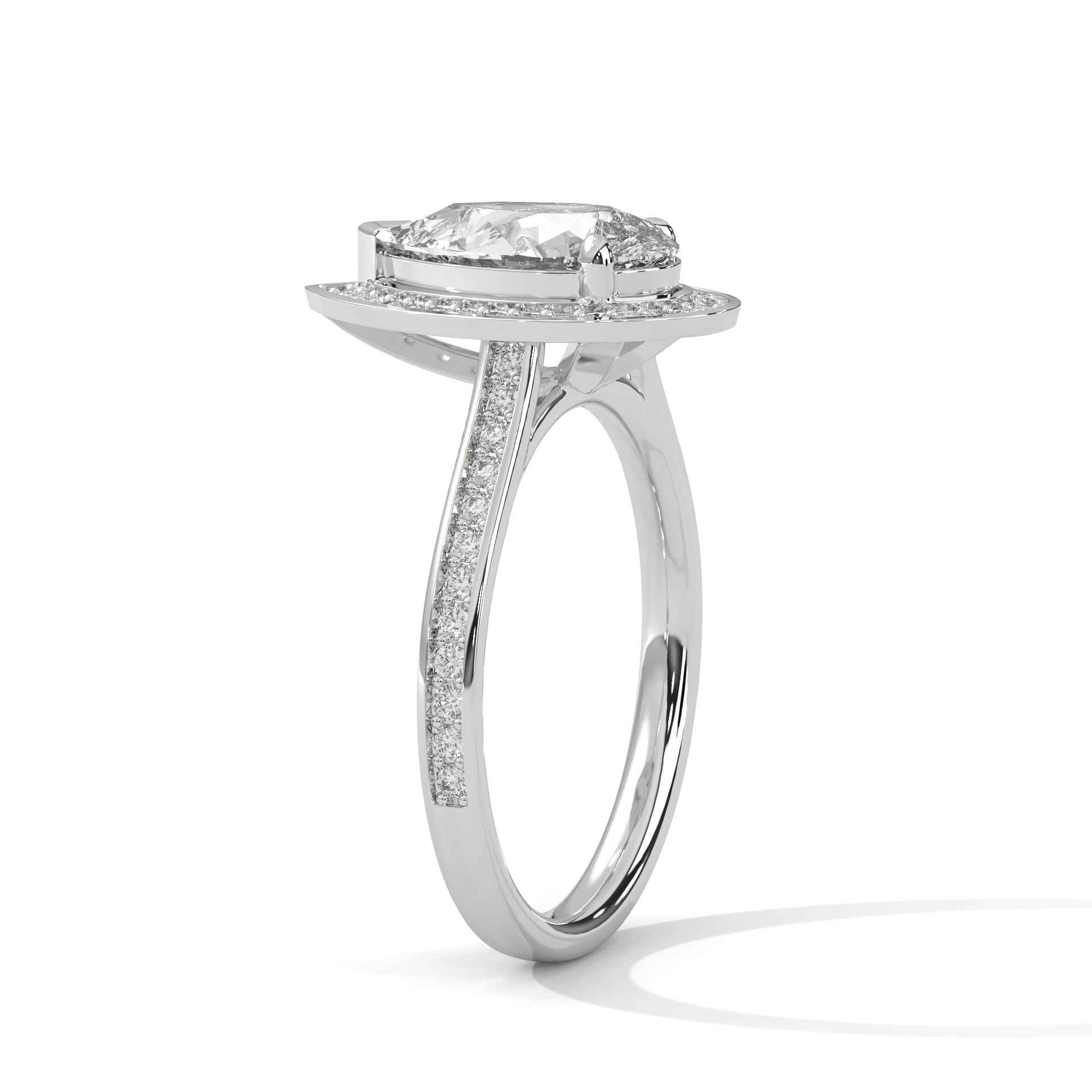 White gold pear-cut halo engagement ring with pavé halo and band