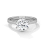 White gold solitaire engagement ring with round center diamond and pavé band