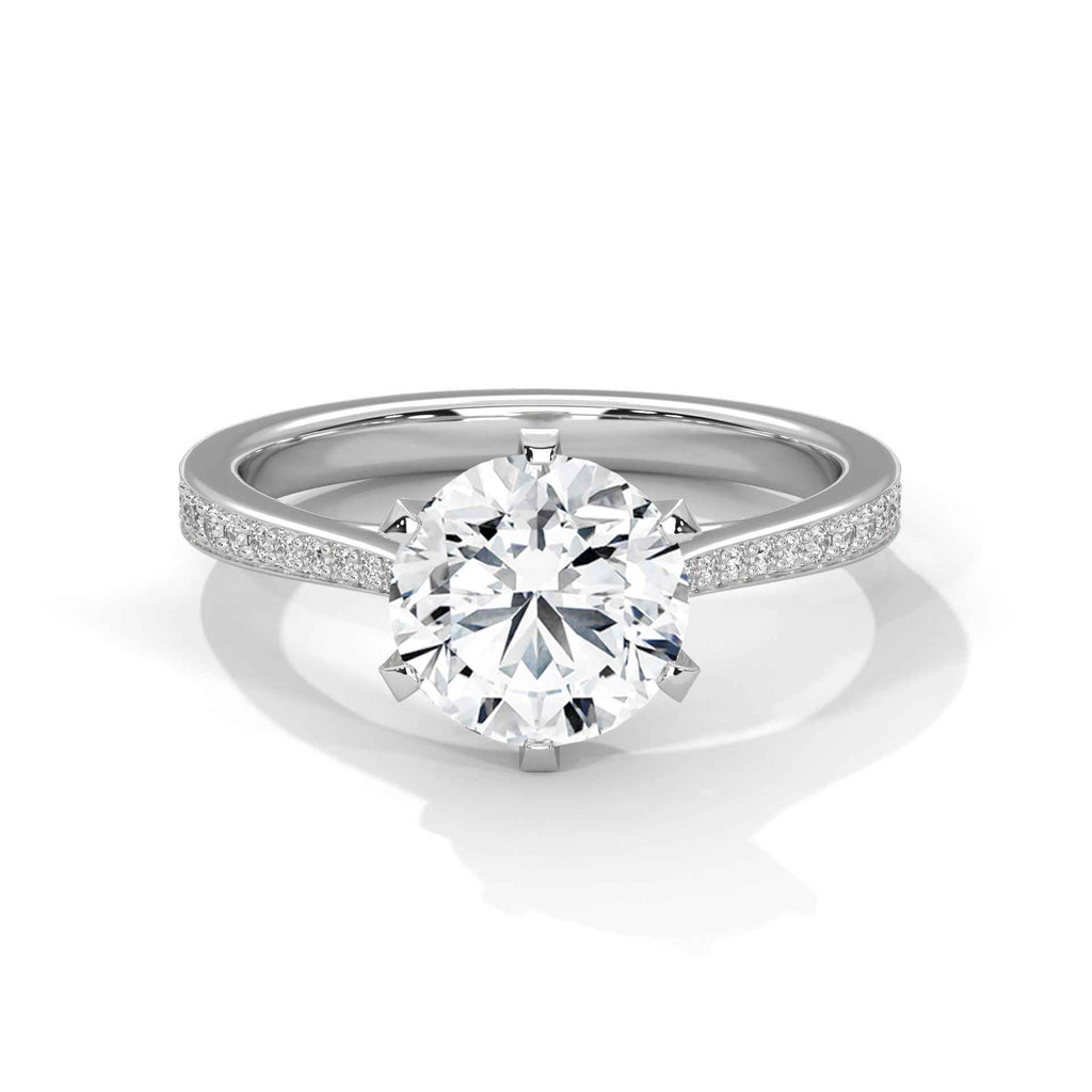 White gold solitaire engagement ring with round center diamond and pavé band