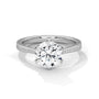 White gold solitaire engagement ring with round center diamond and pavé band