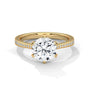 Yellow gold solitaire engagement ring with round center diamond and pavé band