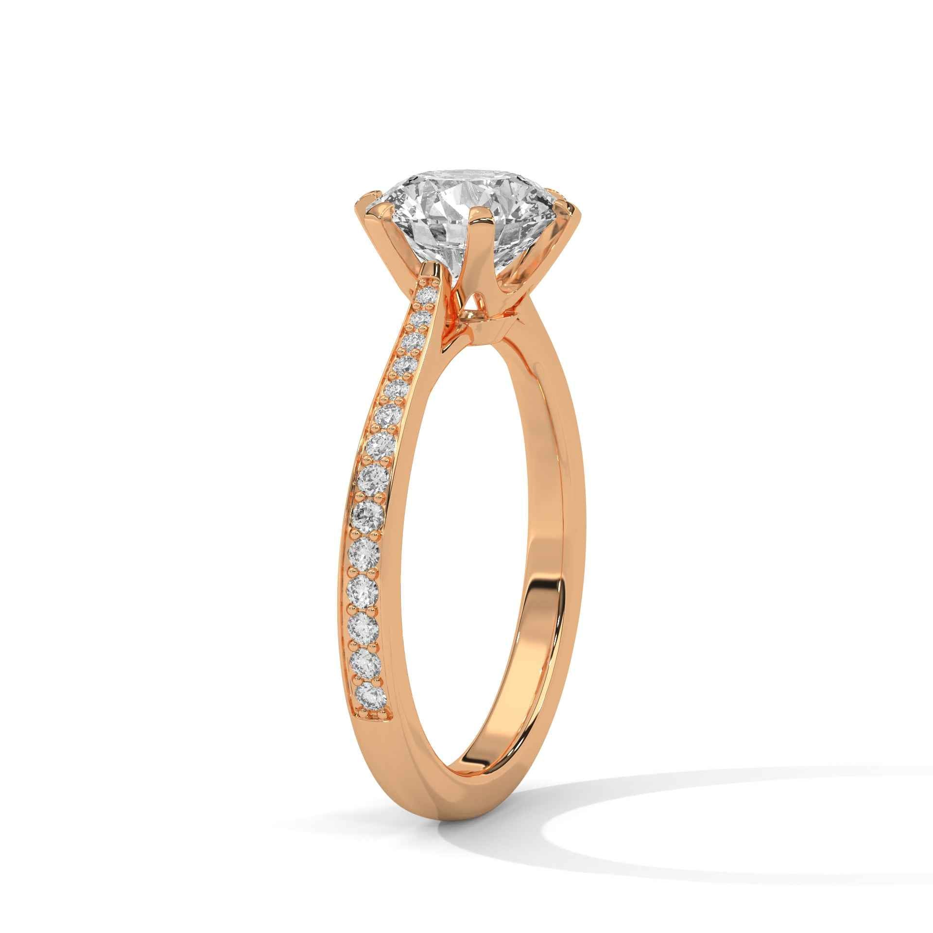 Rose gold solitaire engagement ring with round center diamond and pavé side stones