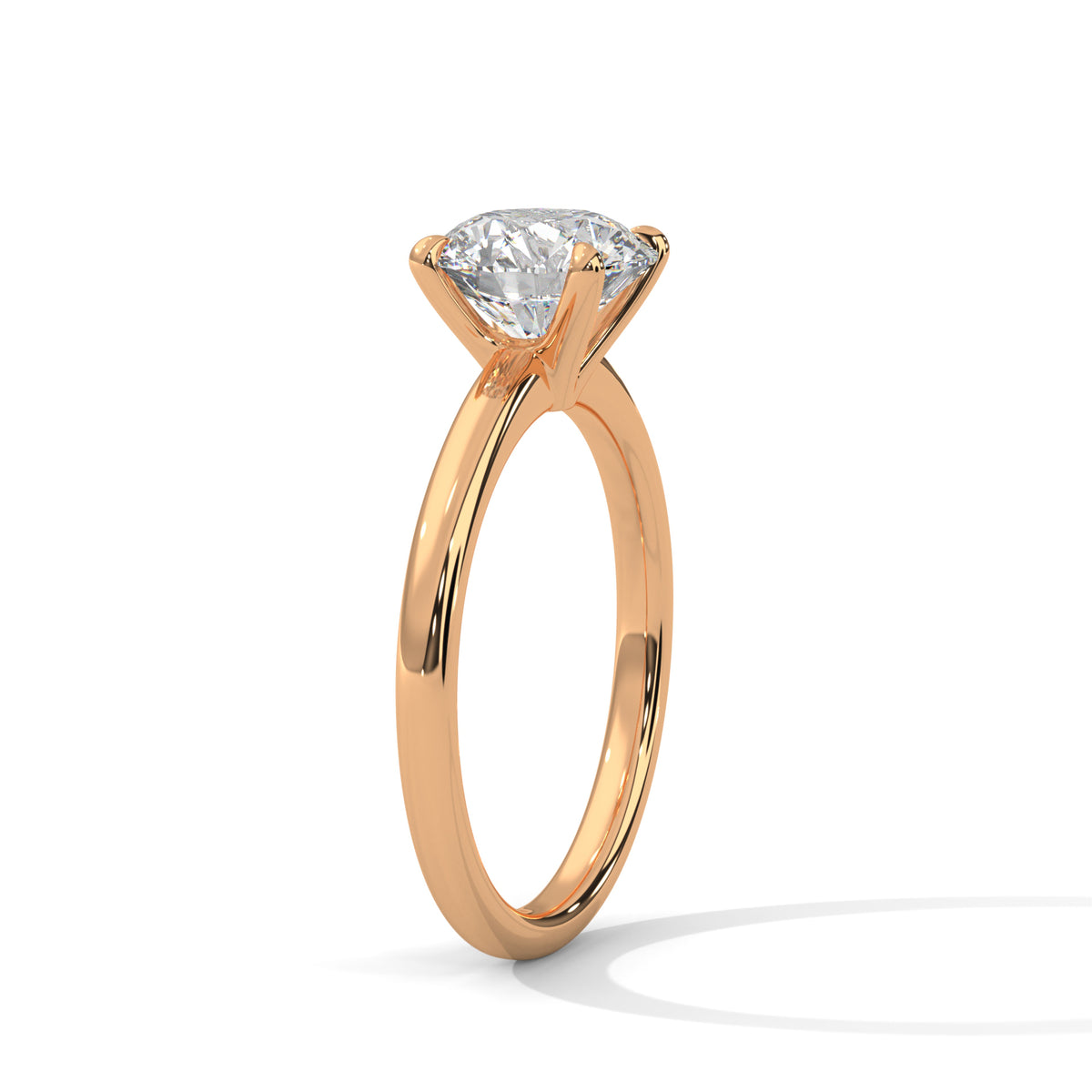 Yellow gold solitaire ring with round center diamond, four-prong basket setting