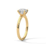 Yellow gold solitaire ring, side view of round diamond with four prongs