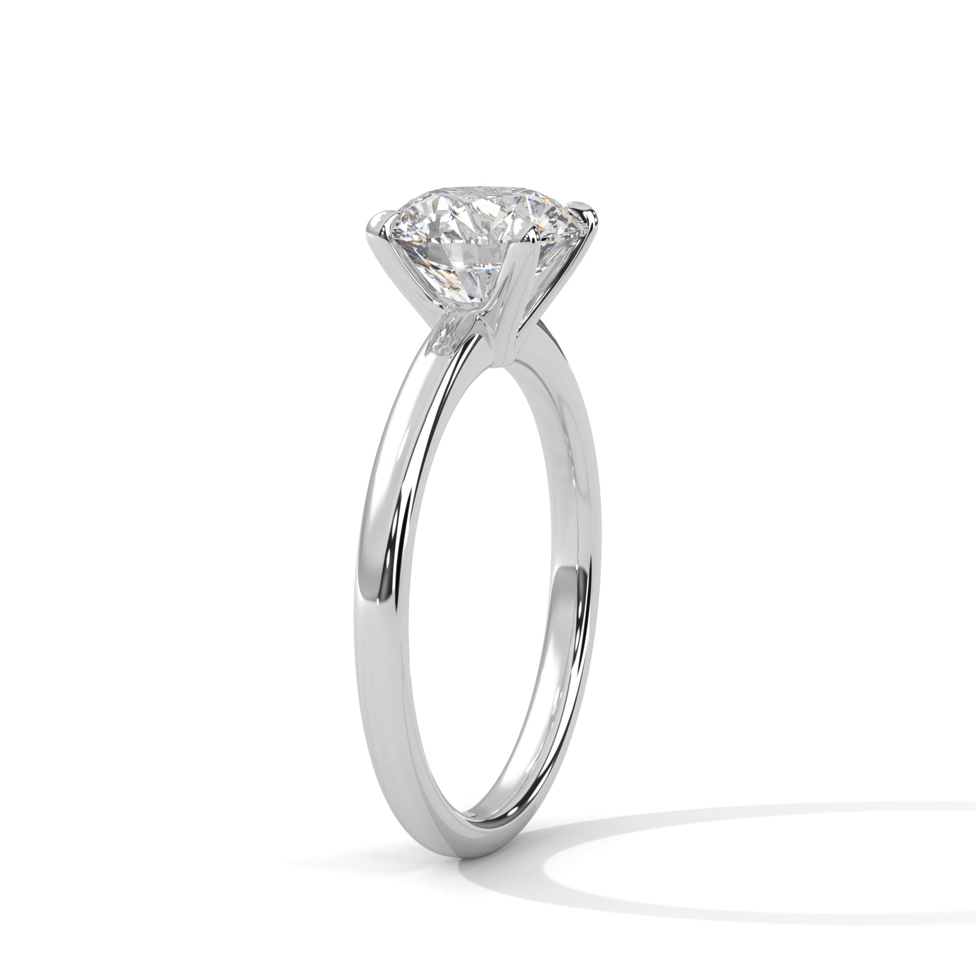White metal solitaire ring with round center diamond, four-prong basket setting
