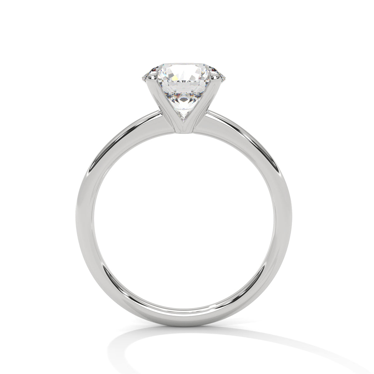 White metal solitaire ring with round center diamond and four-prong head