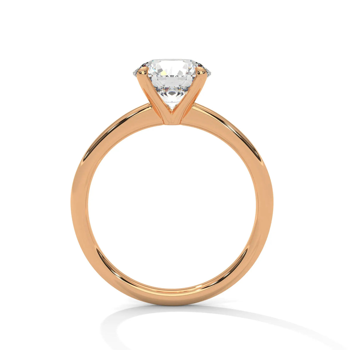 Yellow gold solitaire ring with round center diamond and four-prong head