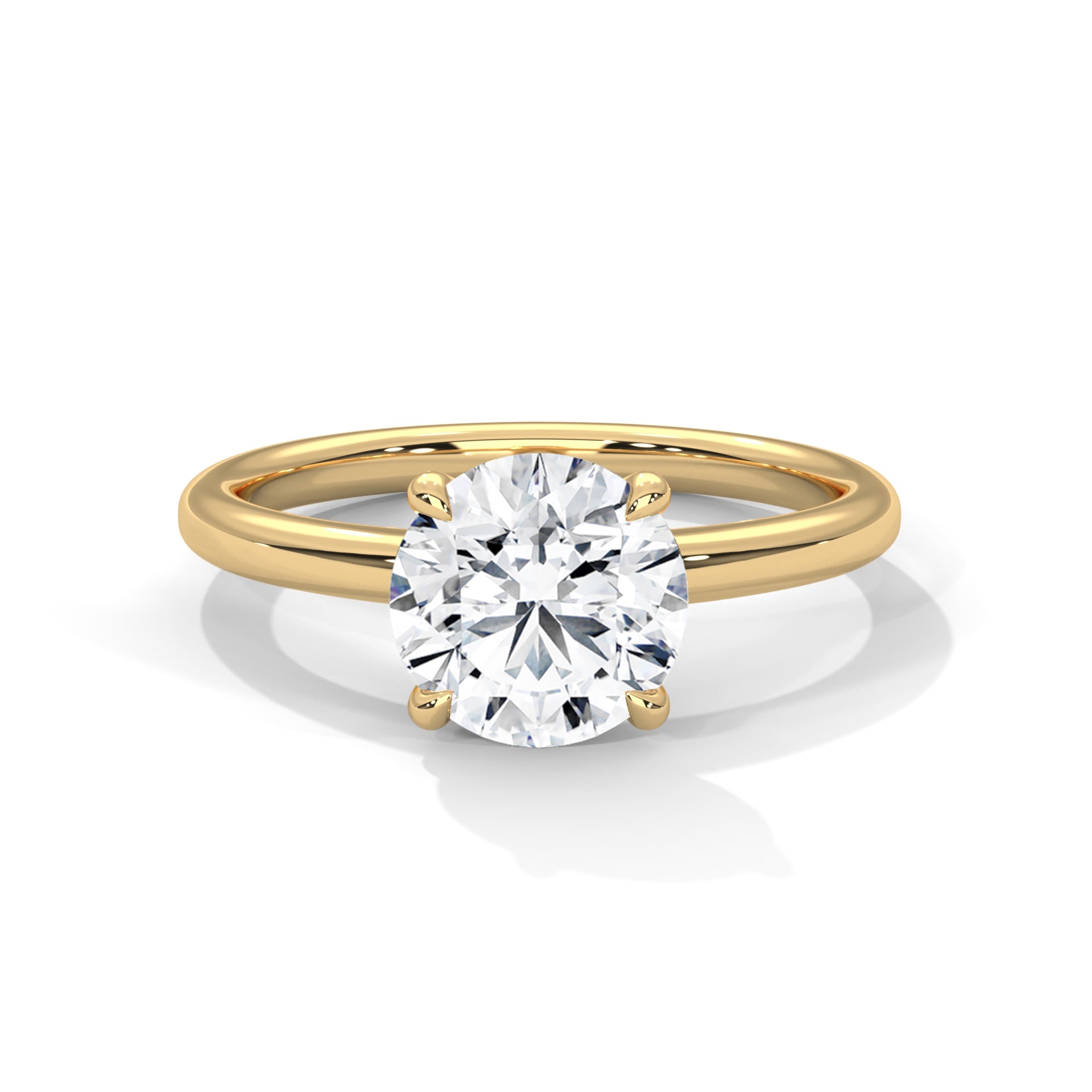 Yellow gold solitaire engagement ring, top view of round four-prong diamond setting