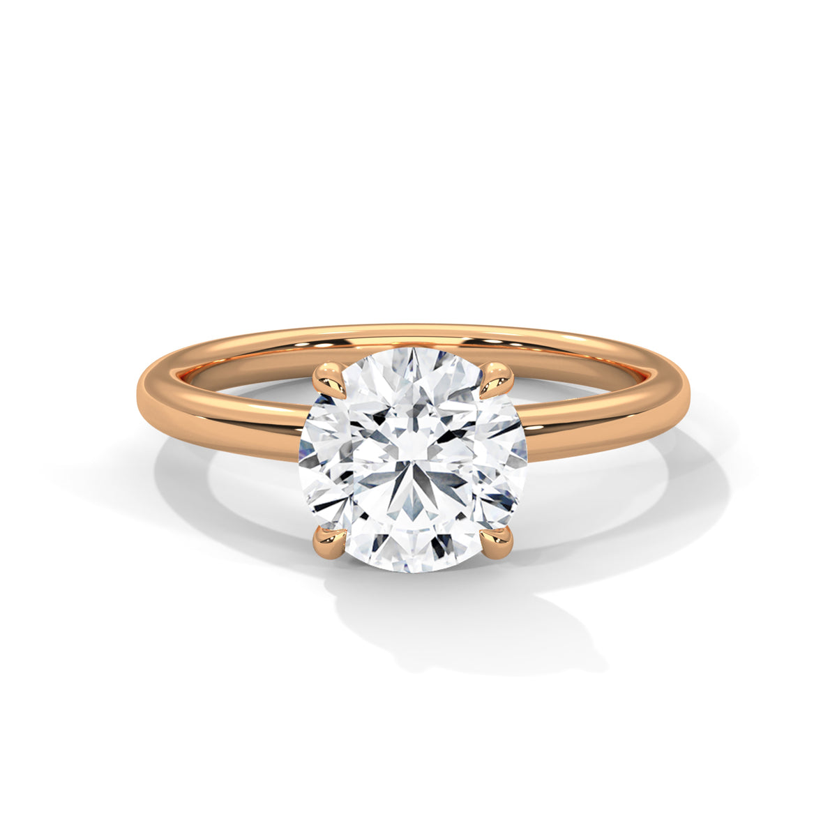 Yellow gold solitaire engagement ring with round diamond in four-prong setting