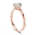 Rose gold engagement ring with round center diamond and hidden halo cathedral setting