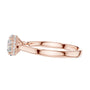 Rose gold engagement ring with round center diamond, halo detail, and cathedral band