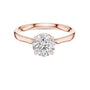 Rose gold solitaire engagement ring with round center diamond and hidden halo border