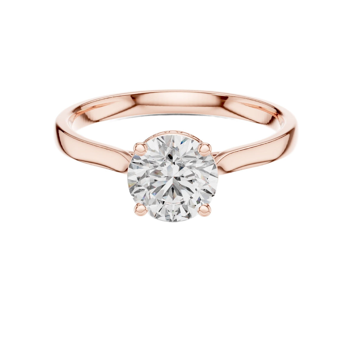 Rose gold solitaire engagement ring with round center diamond and hidden halo border