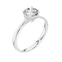 White gold engagement ring with round center diamond and hidden halo cathedral prongs