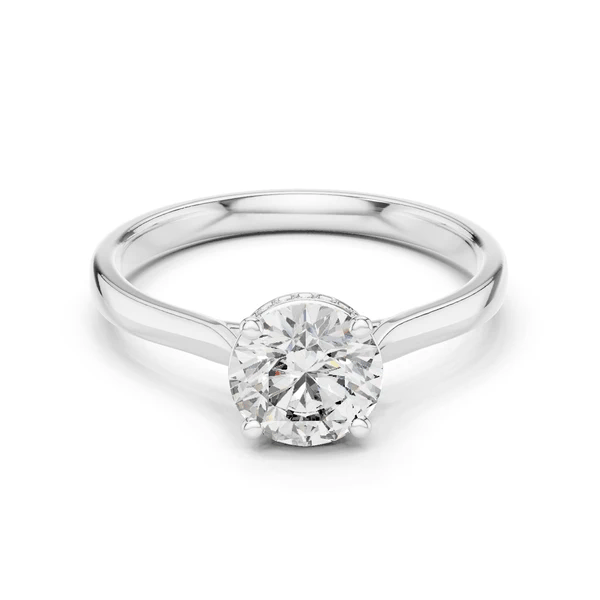 White metal diamond ring with round center stone and halo prong setting