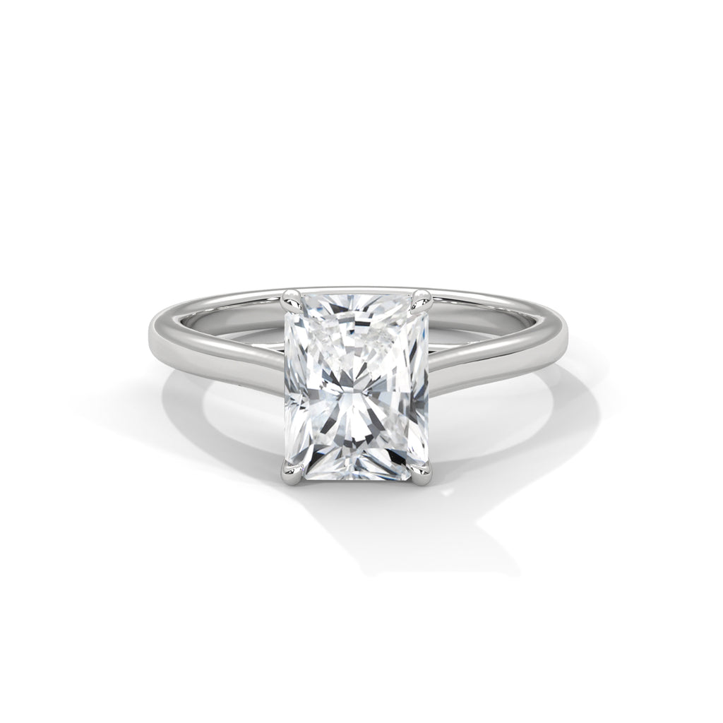 White gold radiant-cut solitaire trellis ring with square center diamond