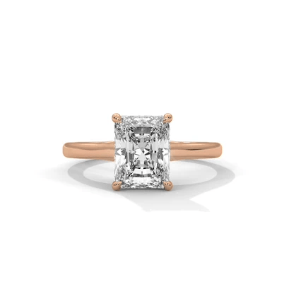 Rose gold solitaire ring with square radiant-cut diamond and four prong setting