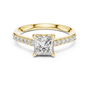 Yellow gold princess-cut diamond ring with pavé shoulders and center diamond.
