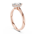 Rose gold oval-cut diamond engagement ring with pavé halo settings