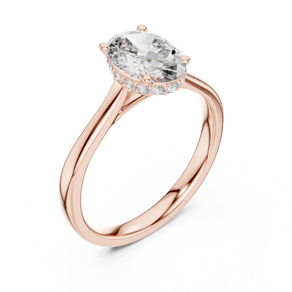 Rose gold engagement ring with oval center diamond and pavé halo band