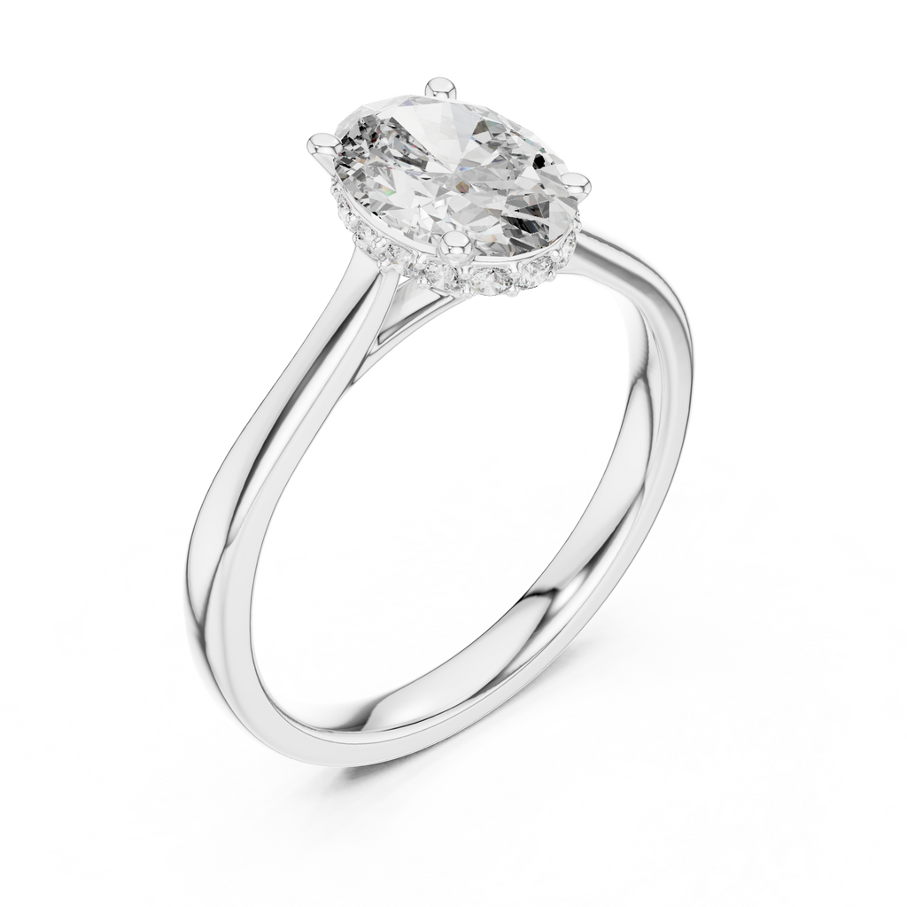 White gold engagement ring with oval center diamond and pavé halo band