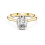 Yellow gold oval diamond ring with center oval stone and hidden halo accents