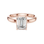 Rose gold emerald-cut solitaire diamond engagement ring with four-prong setting