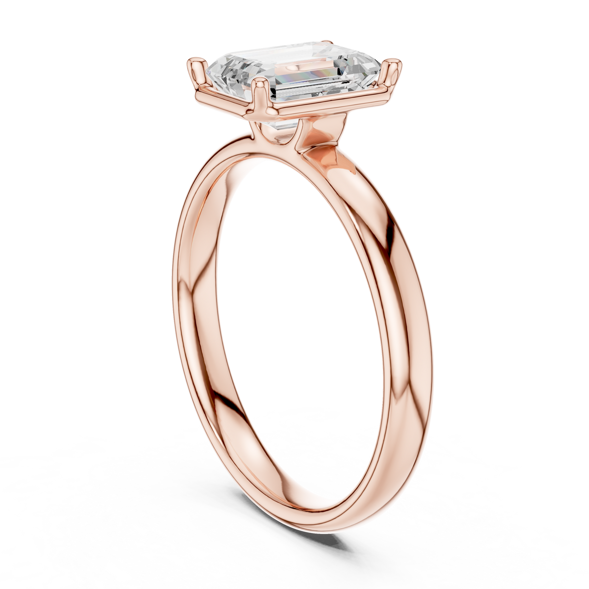 Rose gold emerald-cut solitaire diamond ring, side view with four-prong mount