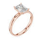 Rose gold emerald-cut solitaire diamond ring, angled view with four-prong setting