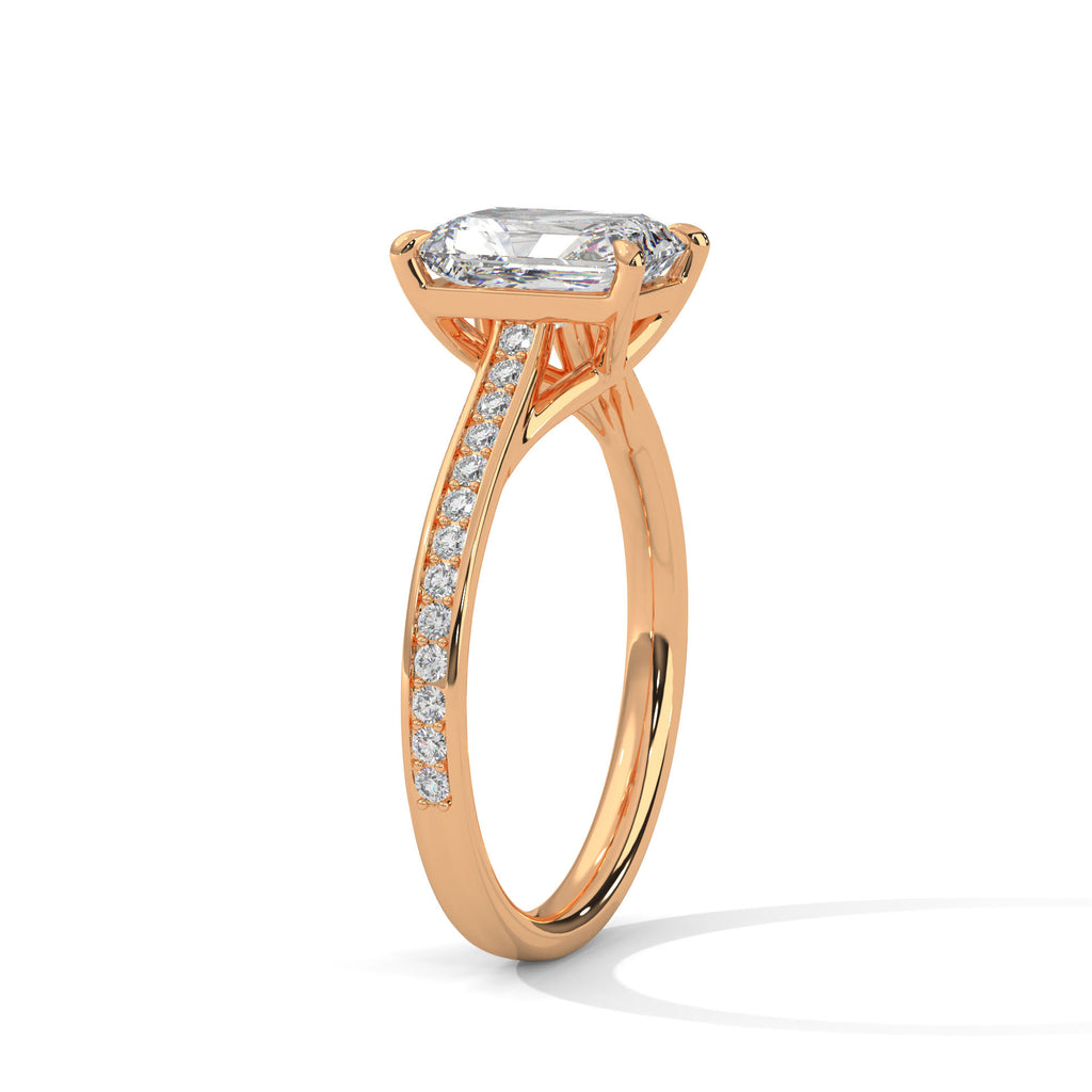 Rose gold radiant cut diamond engagement ring with pave side accents and bezel center