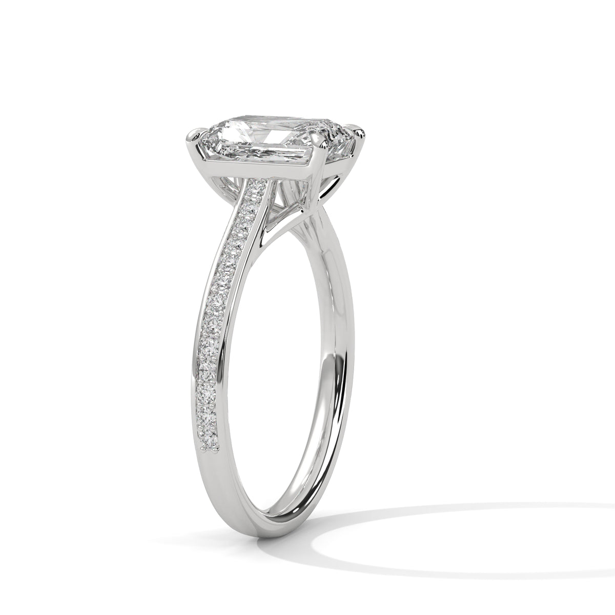 Platinum emerald-cut diamond pavé band ring with side diamond accents