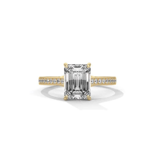 Emerald-cut diamond pavé band ring with yellow gold setting and side diamond accents