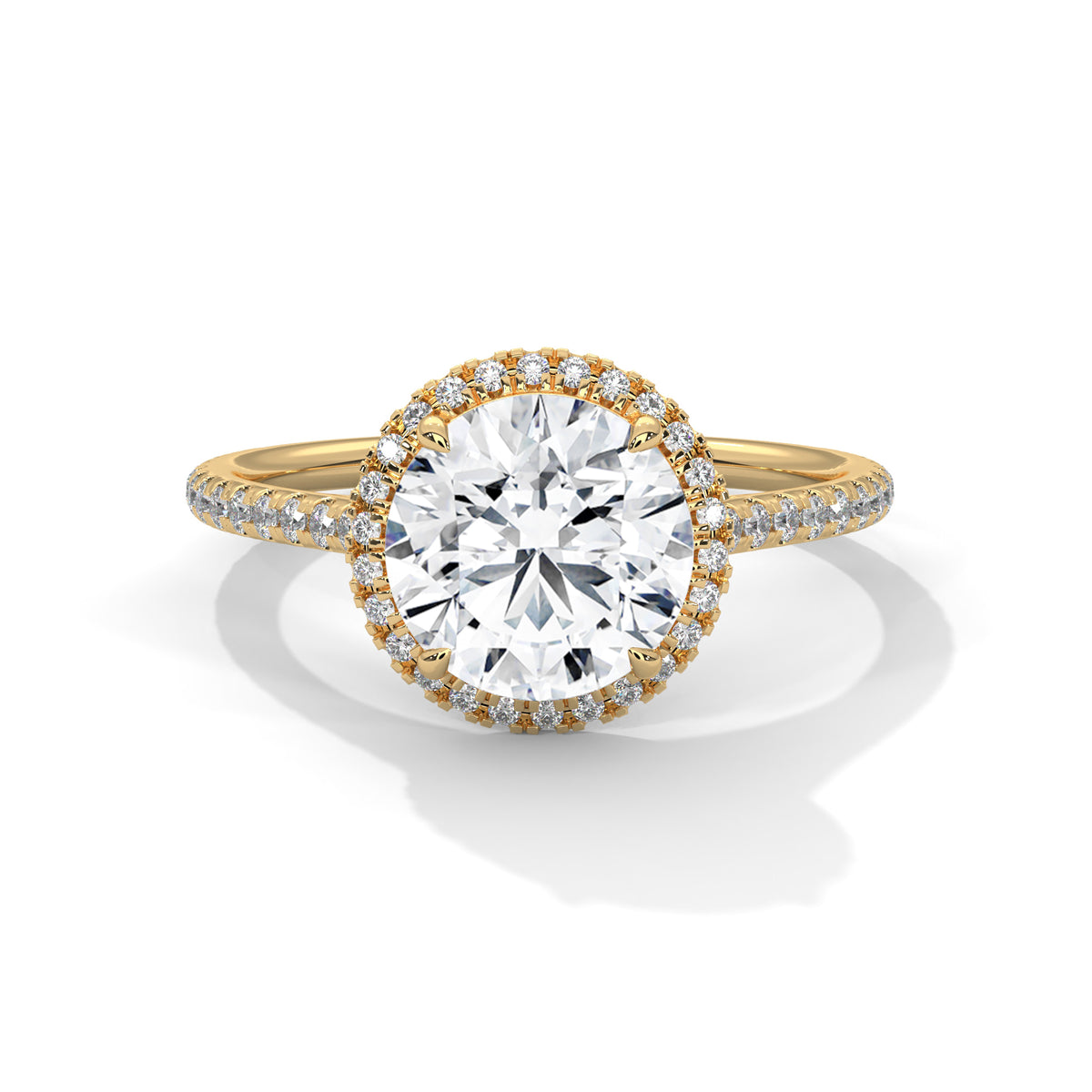Round halo engagement ring with prong-set center stone, yellow gold tone and pavé diamonds